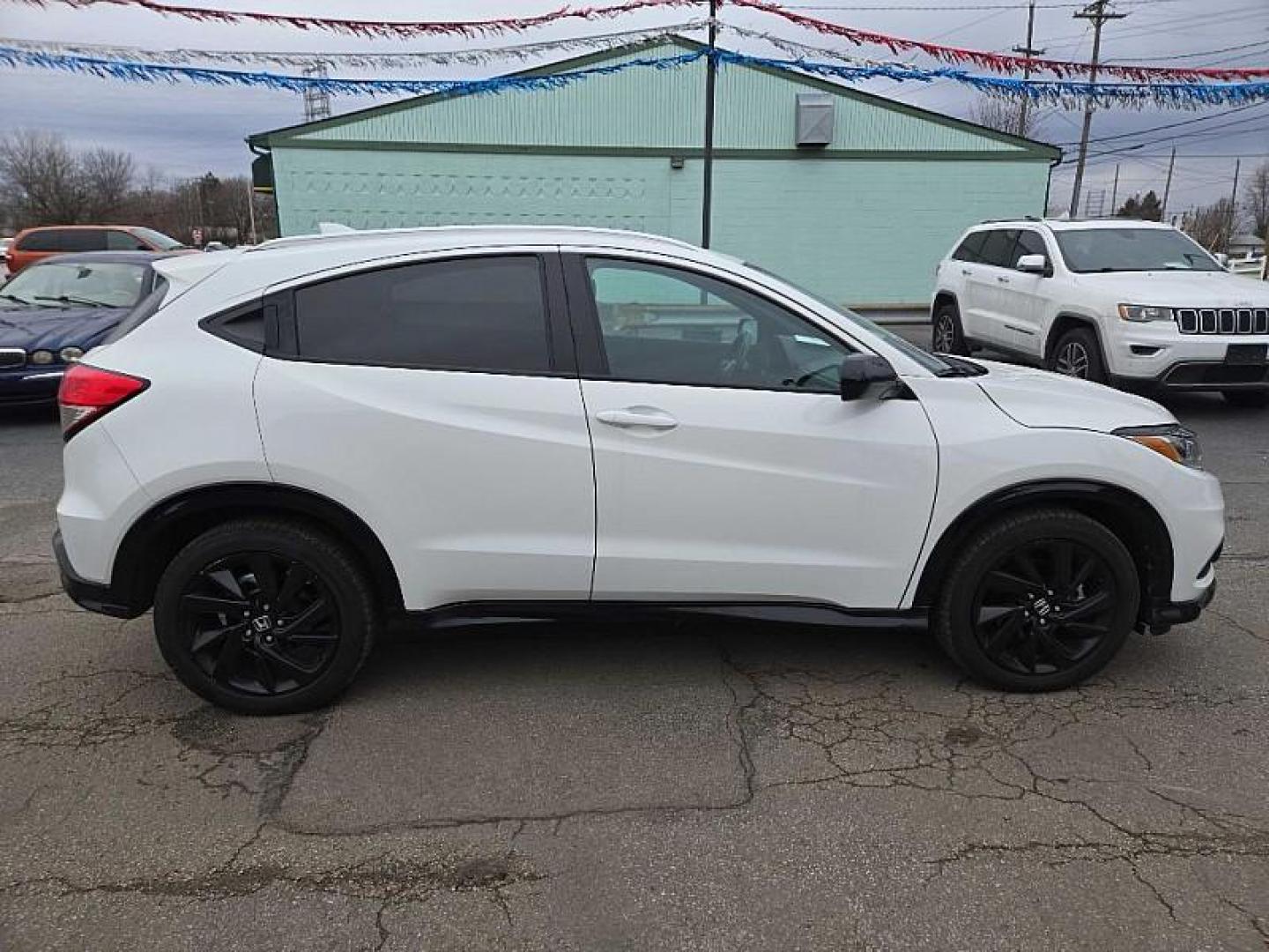 2021 WHITE /BLACK Honda HR-V Sport AWD (3CZRU6H19MM) with an 1.8L L4 DOHC 16V engine, CVT transmission, located at 3304 Woodville Road, Northwood, OH, 43619, (419) 210-8019, 41.612694, -83.480743 - Your #1 Destination for Auto Loans and mdash;No Matter Your Credit!At our dealership, we believe everyone deserves the opportunity to drive their dream car and mdash;whether you have good credit, bad credit, or no credit at all. With a wide selection of hundreds of cars, trucks, and SUVs, you'll fin - Photo#5