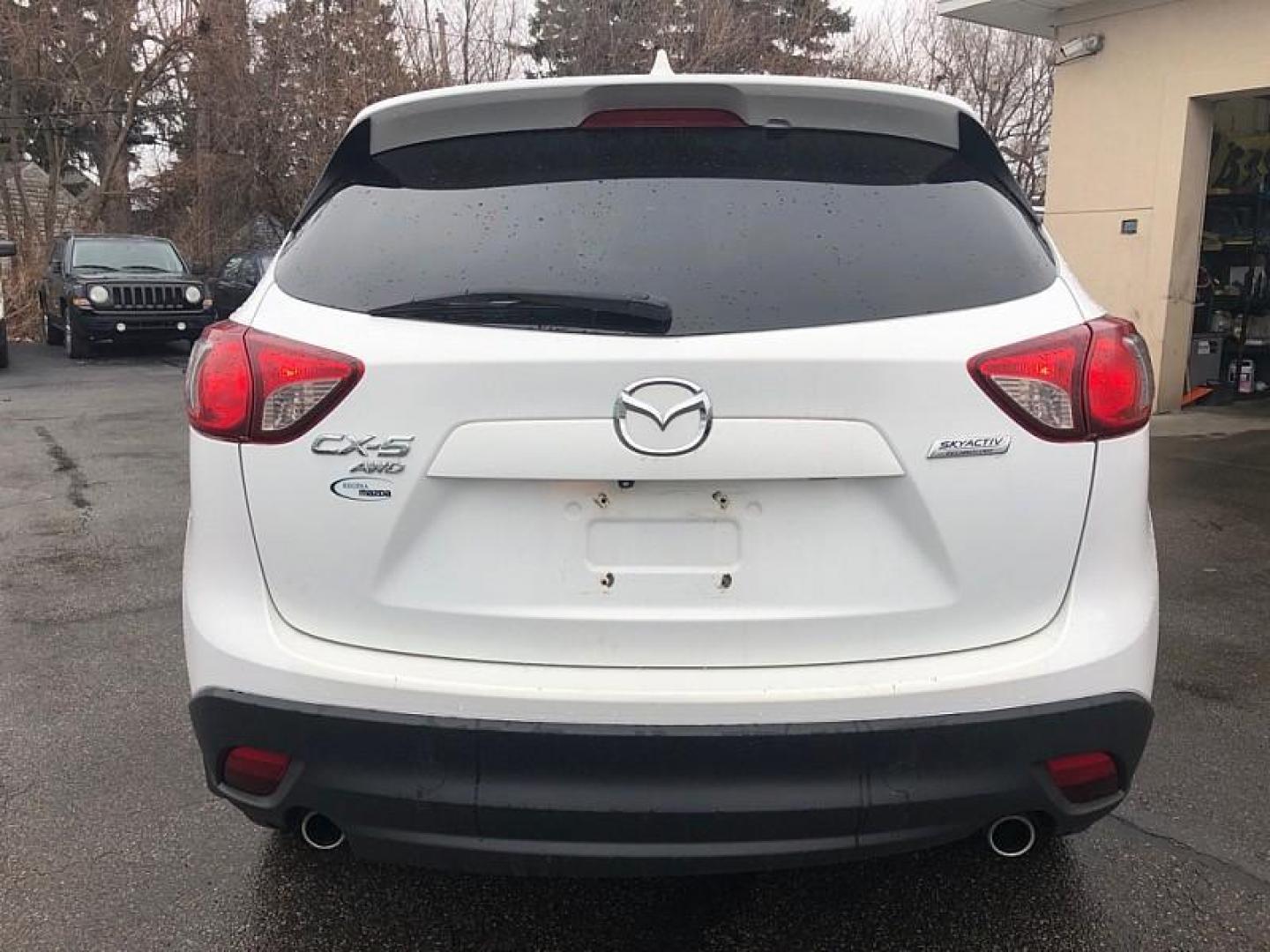 2014 WHITE /BLACK Mazda CX-5 Grand Touring AWD (JM3KE4DYXE0) with an 2.5L L4 DOHC 16V engine, 6-Speed Automatic transmission, located at 3304 Woodville Road, Northwood, OH, 43619, (419) 210-8019, 41.612694, -83.480743 - Your #1 Destination for Auto Loans and mdash;No Matter Your Credit!At our dealership, we believe everyone deserves the opportunity to drive their dream car and mdash;whether you have good credit, bad credit, or no credit at all. With a wide selection of hundreds of cars, trucks, and SUVs, you'll fin - Photo#3