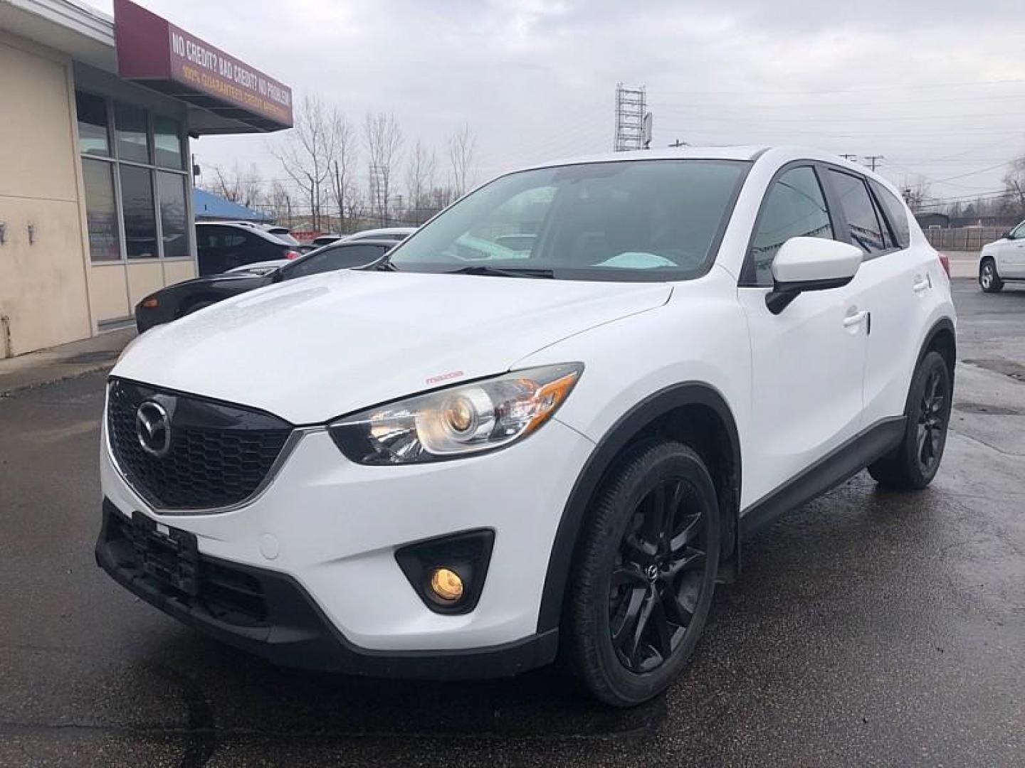 2014 WHITE /BLACK Mazda CX-5 Grand Touring AWD (JM3KE4DYXE0) with an 2.5L L4 DOHC 16V engine, 6-Speed Automatic transmission, located at 3304 Woodville Road, Northwood, OH, 43619, (419) 210-8019, 41.612694, -83.480743 - Your #1 Destination for Auto Loans and mdash;No Matter Your Credit!At our dealership, we believe everyone deserves the opportunity to drive their dream car and mdash;whether you have good credit, bad credit, or no credit at all. With a wide selection of hundreds of cars, trucks, and SUVs, you'll fin - Photo#0