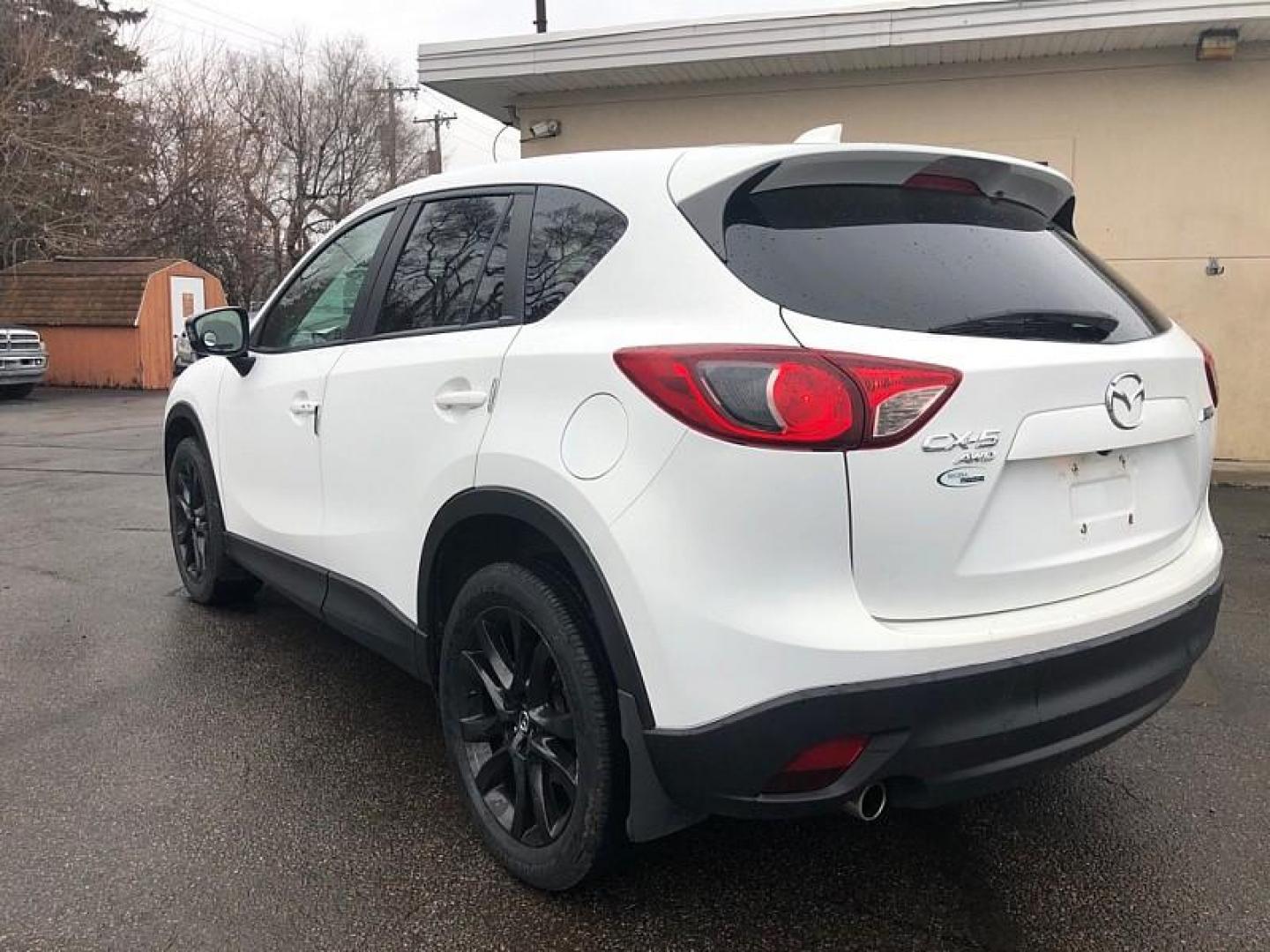 2014 WHITE /BLACK Mazda CX-5 Grand Touring AWD (JM3KE4DYXE0) with an 2.5L L4 DOHC 16V engine, 6-Speed Automatic transmission, located at 3304 Woodville Road, Northwood, OH, 43619, (419) 210-8019, 41.612694, -83.480743 - Your #1 Destination for Auto Loans and mdash;No Matter Your Credit!At our dealership, we believe everyone deserves the opportunity to drive their dream car and mdash;whether you have good credit, bad credit, or no credit at all. With a wide selection of hundreds of cars, trucks, and SUVs, you'll fin - Photo#2