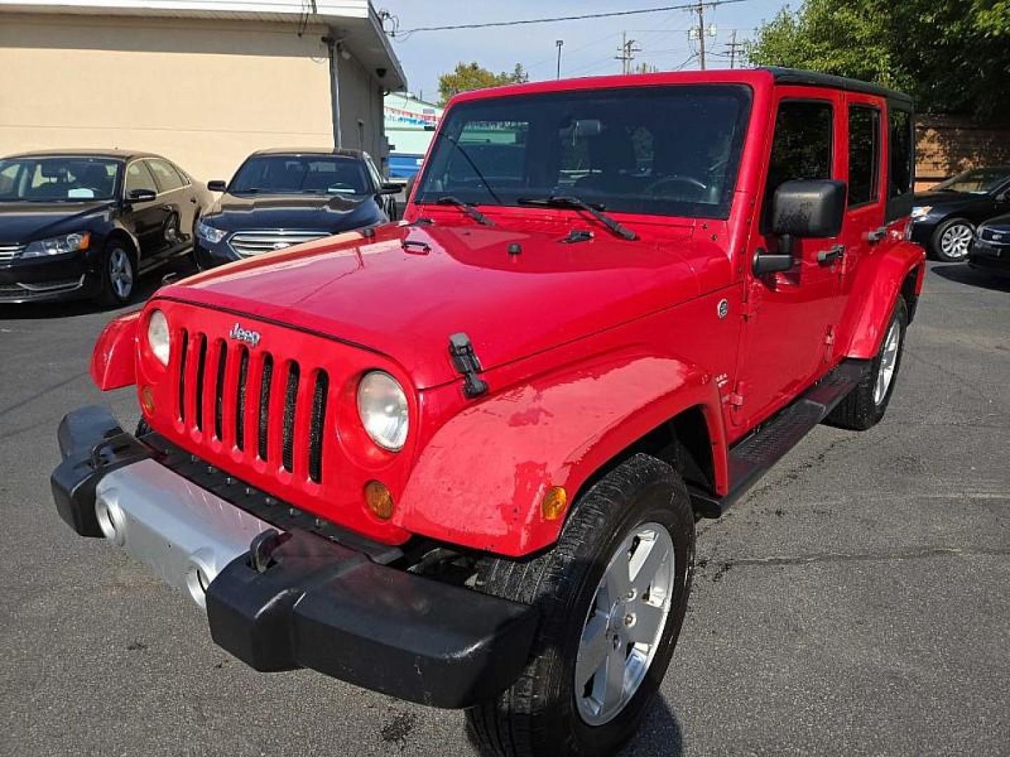 2011 RED /BLACK Jeep Wrangler Unlimited Sahara 4WD (1J4BA5H11BL) with an 3.8L V6 OHV 12V engine, Automatic 4-Spd w/Overdrive transmission, located at 3304 Woodville Road, Northwood, OH, 43619, (419) 210-8019, 41.612694, -83.480743 - We are #1 Auto Loan Dealer for Good Bad or No Credit we have hundreds of vehicles to choose from, stop on in or just fill out our online application to get approved for auto financing and see your credit score for free by visiting our website today. We have Low Payment Options and Terms Available - Photo#0