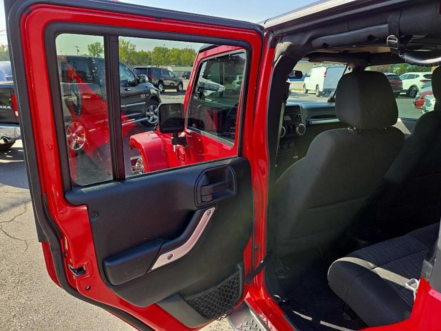 2011 RED /BLACK Jeep Wrangler Unlimited Sahara 4WD (1J4BA5H11BL) with an 3.8L V6 OHV 12V engine, Automatic 4-Spd w/Overdrive transmission, located at 3304 Woodville Road, Northwood, OH, 43619, (419) 210-8019, 41.612694, -83.480743 - We are #1 Auto Loan Dealer for Good Bad or No Credit we have hundreds of vehicles to choose from, stop on in or just fill out our online application to get approved for auto financing and see your credit score for free by visiting our website today. We have Low Payment Options and Terms Available - Photo#9