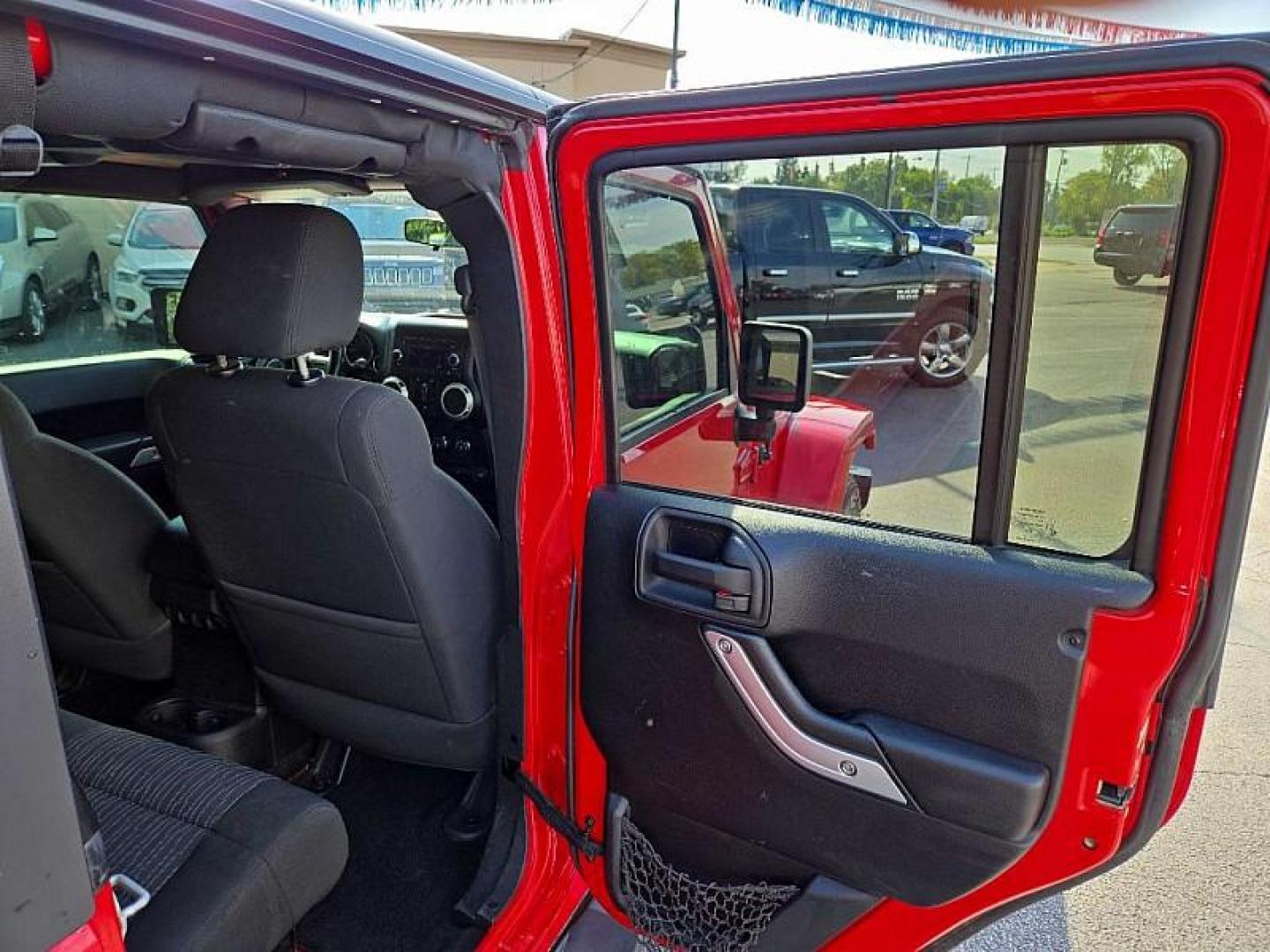 2011 RED /BLACK Jeep Wrangler Unlimited Sahara 4WD (1J4BA5H11BL) with an 3.8L V6 OHV 12V engine, Automatic 4-Spd w/Overdrive transmission, located at 3304 Woodville Road, Northwood, OH, 43619, (419) 210-8019, 41.612694, -83.480743 - We are #1 Auto Loan Dealer for Good Bad or No Credit we have hundreds of vehicles to choose from, stop on in or just fill out our online application to get approved for auto financing and see your credit score for free by visiting our website today. We have Low Payment Options and Terms Available - Photo#13