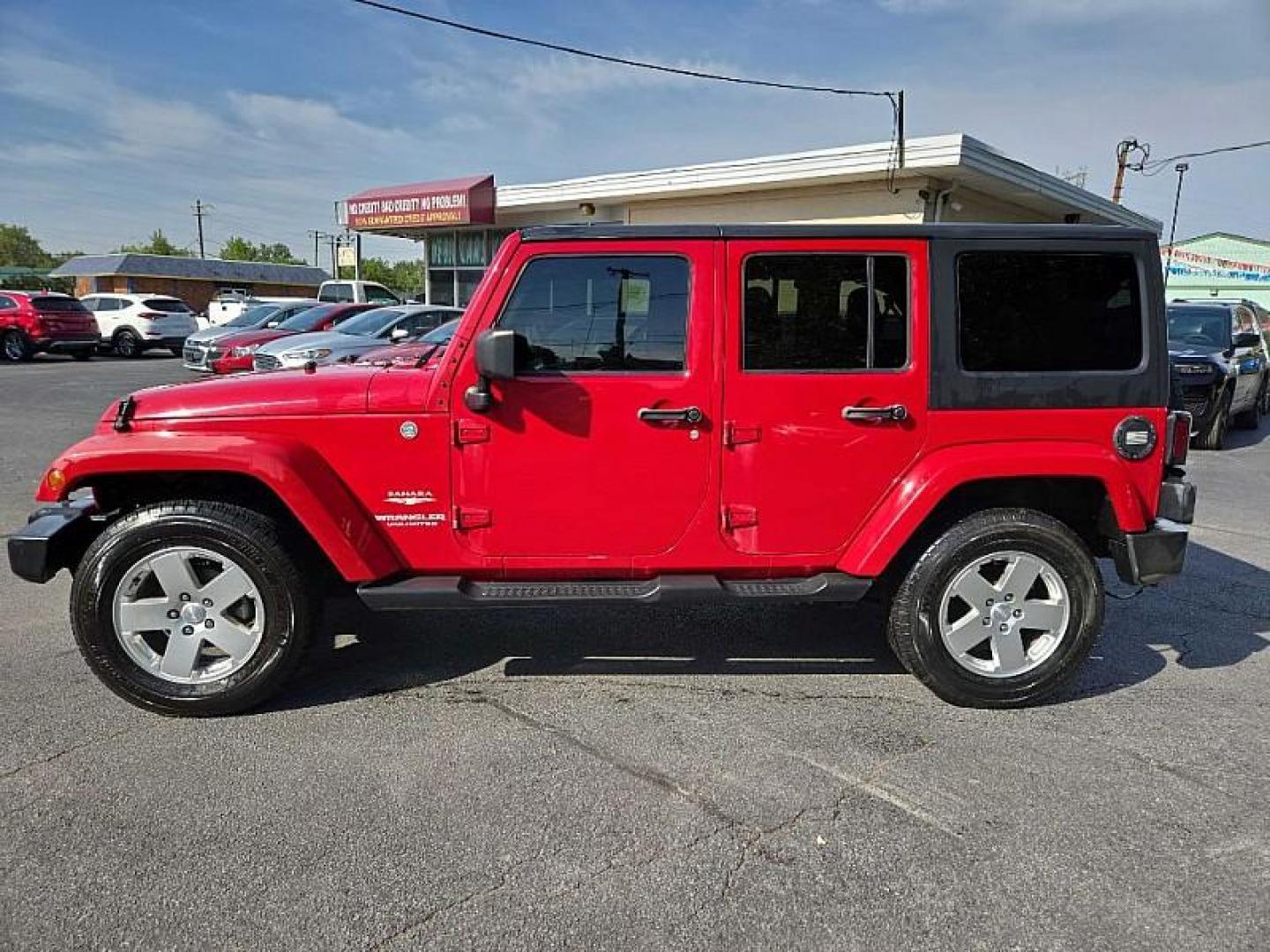 2011 RED /BLACK Jeep Wrangler Unlimited Sahara 4WD (1J4BA5H11BL) with an 3.8L V6 OHV 12V engine, Automatic 4-Spd w/Overdrive transmission, located at 3304 Woodville Road, Northwood, OH, 43619, (419) 210-8019, 41.612694, -83.480743 - We are #1 Auto Loan Dealer for Good Bad or No Credit we have hundreds of vehicles to choose from, stop on in or just fill out our online application to get approved for auto financing and see your credit score for free by visiting our website today. We have Low Payment Options and Terms Available - Photo#3