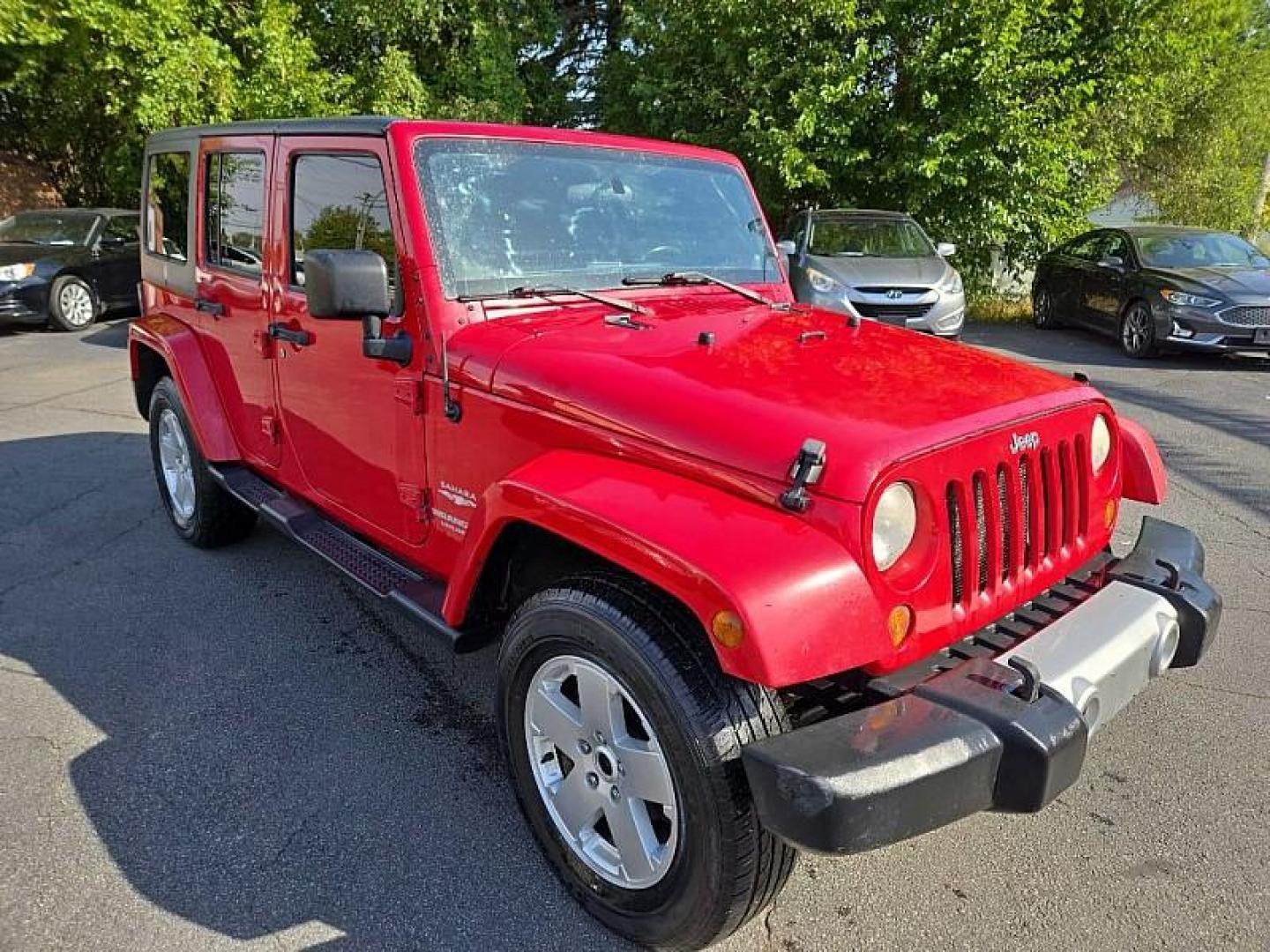 2011 RED /BLACK Jeep Wrangler Unlimited Sahara 4WD (1J4BA5H11BL) with an 3.8L V6 OHV 12V engine, Automatic 4-Spd w/Overdrive transmission, located at 3304 Woodville Road, Northwood, OH, 43619, (419) 210-8019, 41.612694, -83.480743 - We are #1 Auto Loan Dealer for Good Bad or No Credit we have hundreds of vehicles to choose from, stop on in or just fill out our online application to get approved for auto financing and see your credit score for free by visiting our website today. We have Low Payment Options and Terms Available - Photo#5