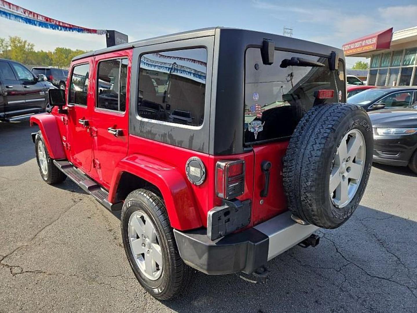 2011 RED /BLACK Jeep Wrangler Unlimited Sahara 4WD (1J4BA5H11BL) with an 3.8L V6 OHV 12V engine, Automatic 4-Spd w/Overdrive transmission, located at 3304 Woodville Road, Northwood, OH, 43619, (419) 210-8019, 41.612694, -83.480743 - We are #1 Auto Loan Dealer for Good Bad or No Credit we have hundreds of vehicles to choose from, stop on in or just fill out our online application to get approved for auto financing and see your credit score for free by visiting our website today. We have Low Payment Options and Terms Available - Photo#6